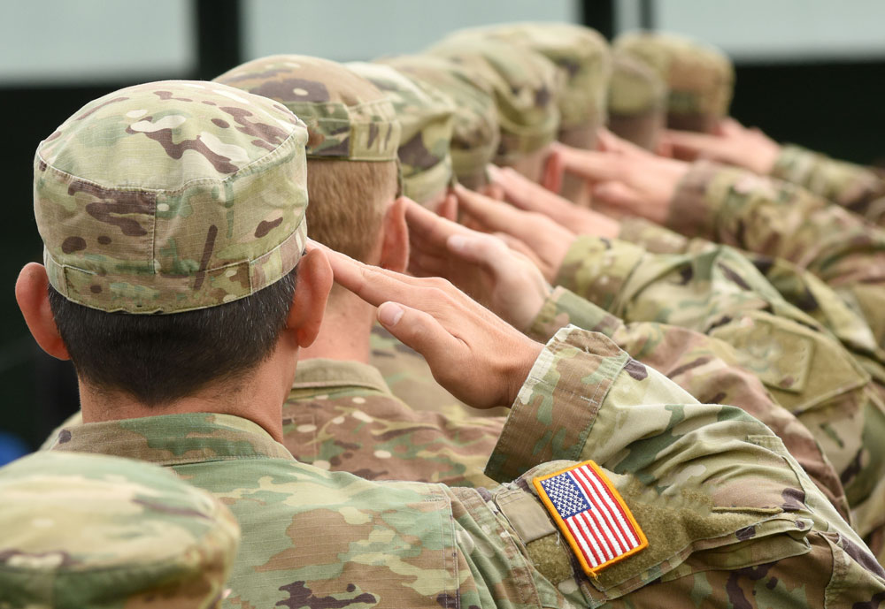 Line of soldiers saluting.